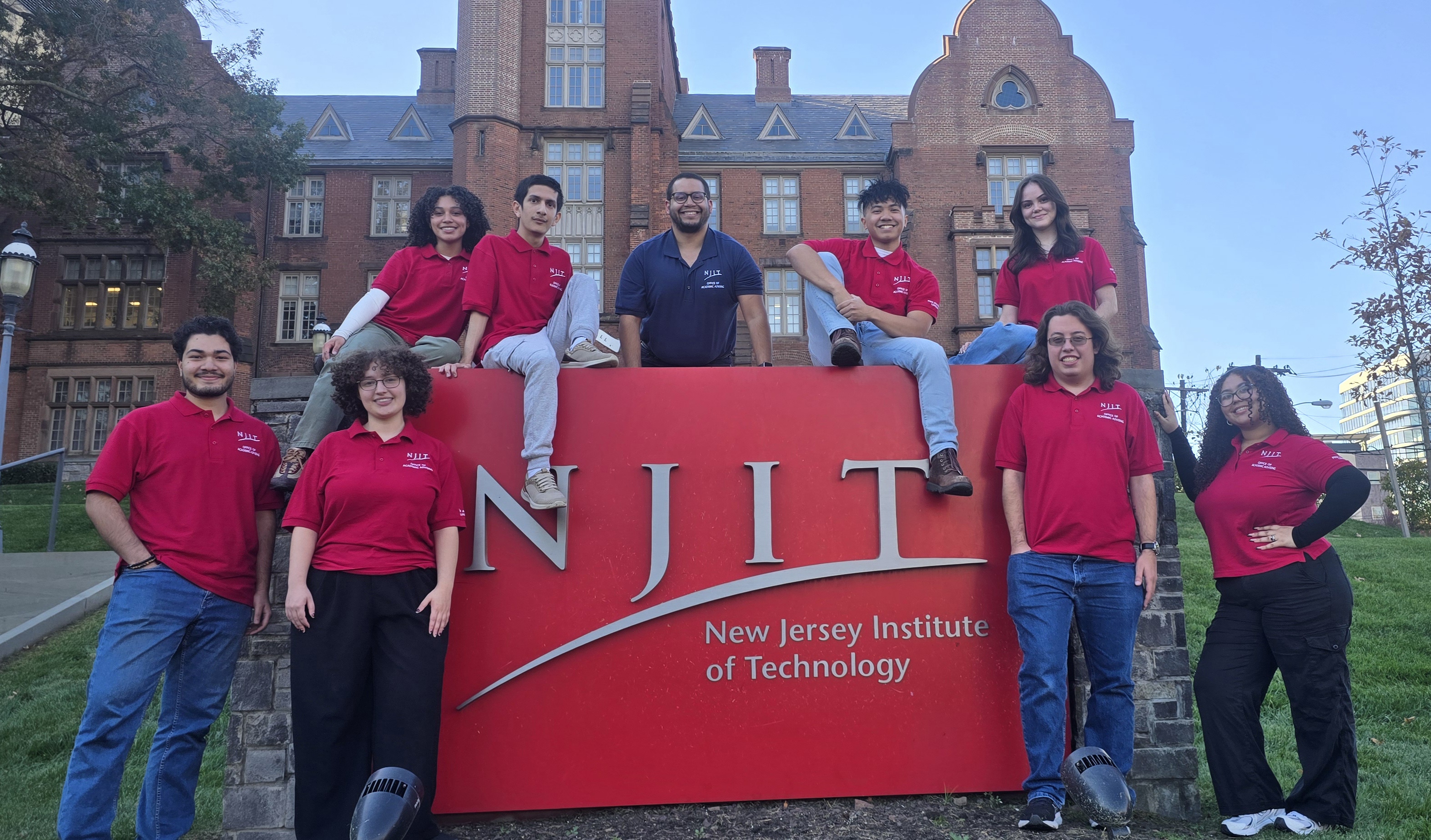 Picture of the PALs in front of the NJIT sign