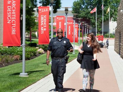 Photo of NJIT Officer escorting a student