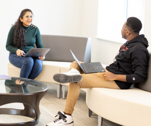 Two NJIT students with laptops