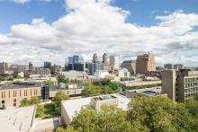 Aerial view of NJIT's campus with the buildings of Newark behind it